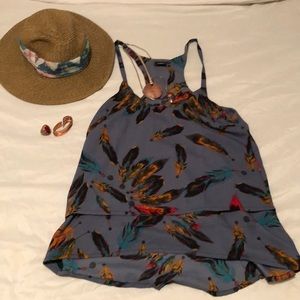 Blue boutique tank with feathers.